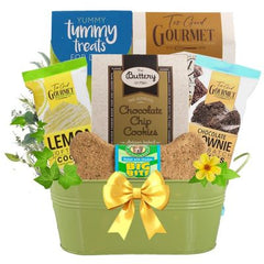 This Gift Includes:
For the Owner:
Chocolate Chip Cookie Dough Soft Baked Cookies 6 oz.
Lemon Soft Baked Cookie 2 Cookie Pack 1 oz.
Buttery on Main Ultimate Chocolate Chip Cookies 2 oz.
Chocolate Brownie Soft Batch 2 Cookie Pack 1 oz.
For the Dog:
Tummy Treats Crunchy Banana Bread Dog Treats 12 oz.
Big Bite Chunky Chicken 8” Biscuit Bone
Oval Metal Container
Gift Size 14” x 6” x 14”
Dim Weight: 15 lbs. (15x15x11)