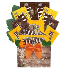 This Gift Includes:
Four (4) Movie Style Box of M&M's
Two (2) Full Size M&M's
Four (4) Fun Size M&M's
Fun and Cheery Box Container
Gift Size 7" x 4" x 12"
Dim Wt: 7 lbs. (15x9x7)
*Our Designers will create your gift using the freshest candy available.
Possible M&M's (depending on availability):
M&M's Milk Chocolate(s)
M&M's Peanut(s)
M&M's Dark Chocolate(s)
M&M's Dark Chocolate Peanut(s)
M&M's Peanut Butter(s)
M&M's Almond(s)
Other M&M's Varieties as available.